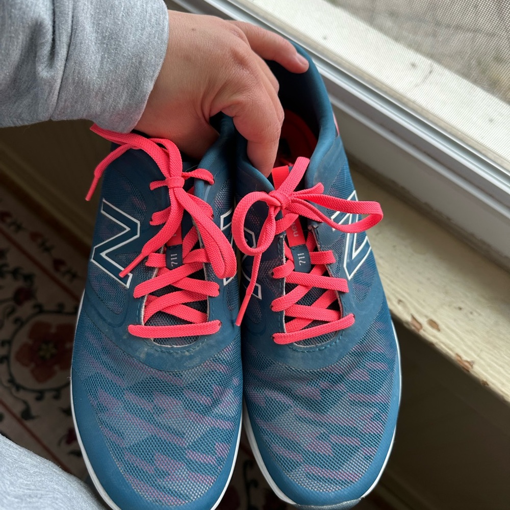 New Balance 711 cross trainer athletic shoes pink and blue